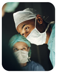 Black Surgeon with Nurse in Background